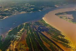 The confluence of the Rio Negro (black) and the Rio Solimões (turbid) near Manaus, Brazil