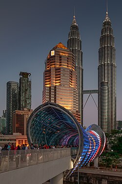 The Saloma Link seen at dusk, with the Petronas Tower behind it.