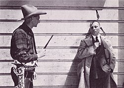 Bee Ho Gray throwing knives at Erich von Stroheim on the set of Greed