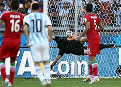 Messi watches his 25-yard strike hit the net against Iran as Argentina wins its second group game at the 2014 FIFA World Cup.