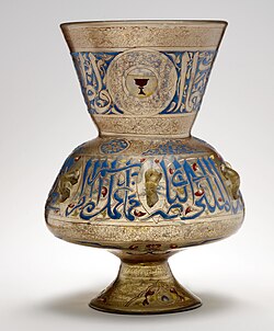 Mosque lamp of Amir Qawsun, dated 1329. Qawsun's blazon, a red cup on a yellow field, is prominently visible on the upper section. Metropolitan Museum of Art.[295]