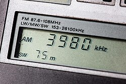 Portable shortwave receiver's digital display tuned to the 75–meter band