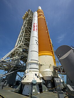 SLS of Artemis II, with side view showing one of the two boosters