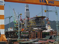 One of the world's largest oil and gas projects, Sakhalin-II- Lunskoye platform under construction. The topside facilities of the LUN-A (Lunskoye) and PA-B (Piltun Astokhskoye) platforms were built at the Samsung Heavy Industries' shipyard in South Korea.[50]