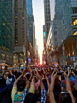 Tourists observing Manhattanhenge on 42nd Street on July 12, 2016