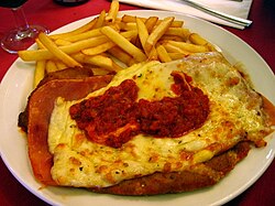 "Milanesa a la napolitana" with French fries