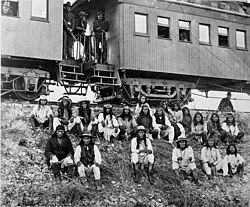 Band of Apache Indian prisoners at rest stop beside Southern Pacific Railway, near Nueces River, Texas, September 10, 1886. (Geronimo is third from the right, in front)