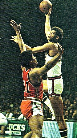 Kareem Abdul-Jabbar, shown shooting his signature "skyhook" shot, was a record six-time MVP winner.[43]