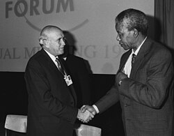F.W. de Klerk and Nelson Mandela shake hands in January 1992.