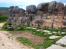 Reconstructed wall of Ain Dara Temple with cherubim relief in lower panel