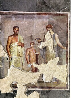 An ancient fresco depicting a poet (thought to be Euphorion) and a woman reading a diptych