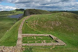 A segment of the ruins of Hadrian's Wall in northern England, overlooking Crag Lough