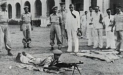 First Prime Minister of Independent Sri Lanka D. S. Senanayake visiting the 1st battalion of the CLI at the Echelon Square and watching volunteers being trained to handle light machine guns.