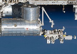 Kibō with its exposed facility on the right