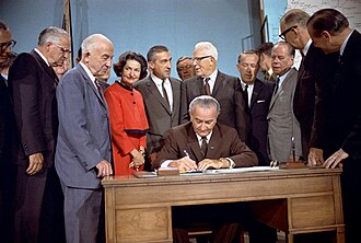 President Johnson signs the National Wild and Scenic Rivers Act into law, c. October 2, 1968