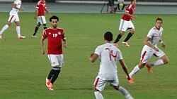 Salah (number 19) playing for Egypt against Tunisia during a friendly match in October 2012