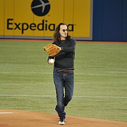 Lee is an avid baseball fan with an immense collection of memorabilia, including authentic signatures from Christy Mathewson, Murderers' Row, Mickey Mantle, and presidents of the United States.[65] Pictured is Lee throwing a ceremonial first pitch for the Toronto Blue Jays in 2013