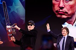 Milei with Elon Musk holding a chainsaw; the chainsaw has become a popular symbol associated with Milei.