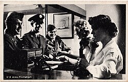 Operators assist US Army soldiers in making a telephone call at Fort Dix, 1940s or 1950s