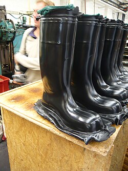 Compression molded (cured) rubber boots before the flashes are removed