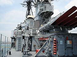 Velos on 20 May 2006: Amidships view to bow and bridge, the 533 mm (21 in) torpedo tubes and 76 mm (3 in) AA guns can be seen. Note the rank flag flown at the foremast displacing downward the commissioning pennant revealing that the ship is regarded as in commission.
