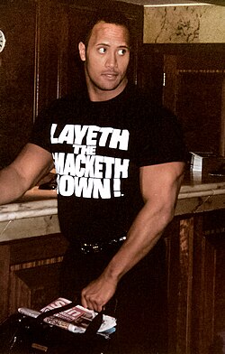 The Rock's popularity in the Attitude Era was fueled by his charisma and speaking abilities, which led to many catchphrases and merchandising opportunities.[64]
