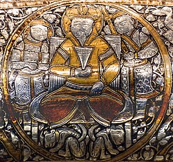 Enthroned ruler and attendants in the Baptistère de Saint Louis (1320–1340). This is a probable depiction of Sultan Baybars.[45]