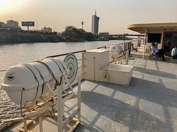 A boat on the Blue Nile before the Al Mansheiya Bridge.