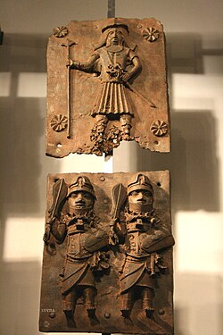 Two brass plates depicting a bearded Portuguese soldier before 1500 on top and Benin warriors at the bottom
