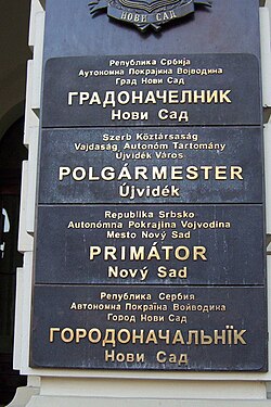 Multilingual sign outside the mayor's office in Novi Sad, written in the four official languages of the city: Serbian, Hungarian, Slovak, and Pannonian Rusyn