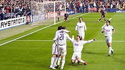 Real Madrid players celebrating a goal against Bayern Munich in 2007