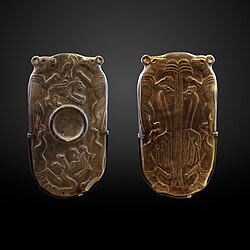 Cosmetic palette from the Naqada III period depicting African wild dogs, Louvre