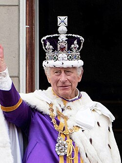King Charles III (wearing the Imperial State Crown), the living embodiment of the Crown in each of the Commonwealth realms
