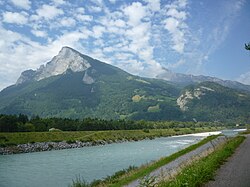 The Alpine Rhine border between Liechtenstein and Switzerland (view towards the Swiss Alps)