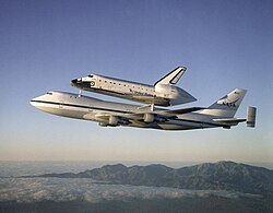 Space Shuttle Atlantis being transported by a Boeing 747 Shuttle Carrier Aircraft