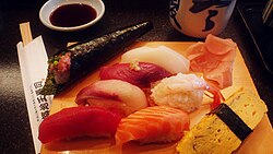 Many types of fish ready to be eaten, including salmon and tuna