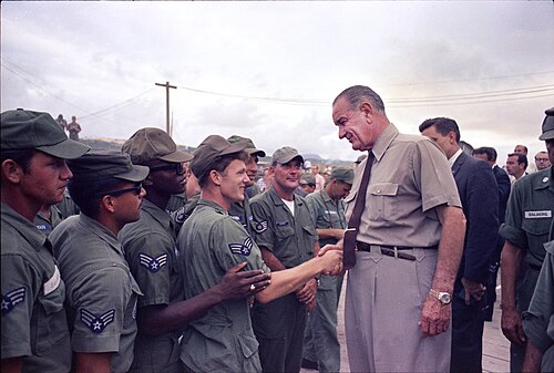 President Johnson shakes hands with U.S. airmen at Cam Ranh Bay in South Vietnam, c. October 1966