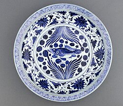A Yuan dynasty blue-and-white porcelain dish with fish and flowing water design, mid-14th century, Freer Gallery of Art
