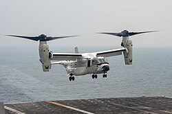 A CMV-22 lands on the deck of USS Carl Vinson
