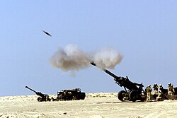 A 155 mm artillery shell fired by a United States 11th Marine Regiment M-198 howitzer