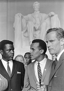 Belafonte (center) at the 1963 Civil Rights March on Washington, D.C., with Sidney Poitier (left) and Charlton Heston