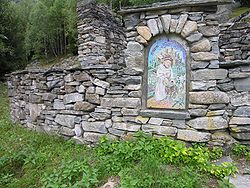 Mosaic embedded in stone wall, Italian area of Switzerland