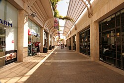 Mamilla Mall adorned with upscale shops stands just outside the Old City Walls.
