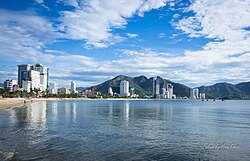 Photograph of Nha Trang beach with many high rise buildings behind it