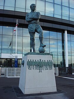 Statue of Bobby Moore, England's 1966 FIFA World Cup winning captain, stands outside the stadium entrance looking down Olympic Way.