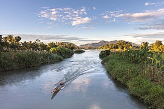 A boat floats on the Mekong in Laos.