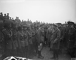King George V inspects Indian troops attached to the Royal Garrison Artillery at Le Cateau, 2 December 1918