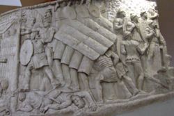 The Roman testudo performed during a siege, as shown on Trajan's Column