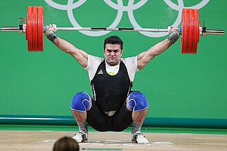 Mohammad Reza Barari, an Iranian lifter, snatching at the 2016 Olympic Games in Rio, Brazil