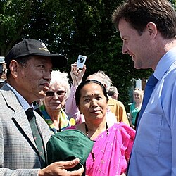 Nick Clegg being presented a Gurkha Hat by a Gurkha veteran during his Maidstone visit, to celebrate the success of their joint campaign for the right to live in the UK, 2009